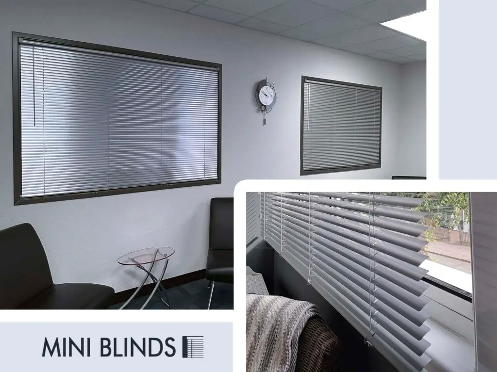 A modern office space features two windows with gray horizontal blinds, one partially opened to reveal greenery outside. Black cushioned seating and a glass table with a magazine complete the interior design. A wall clock hangs above, enhancing the elegant window coverings. Text reads MINI BLINDS.